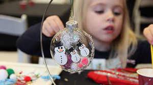 Girl creates a custom holiday ornament