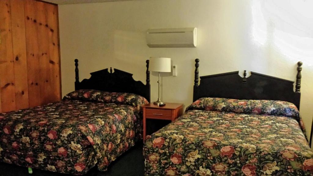 hotel room with queen beds