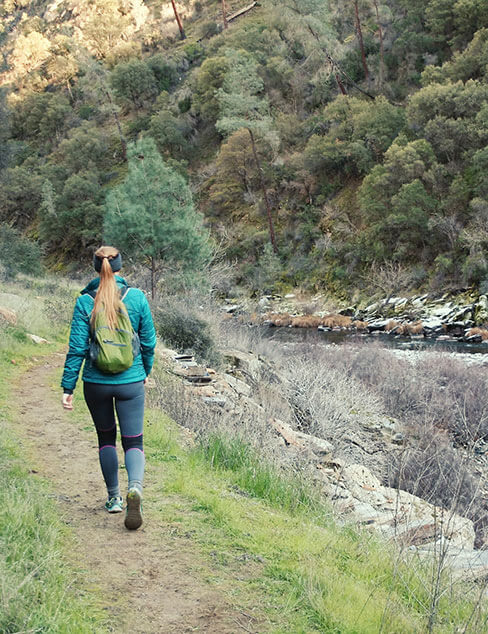 Woman hiking along the Merced River