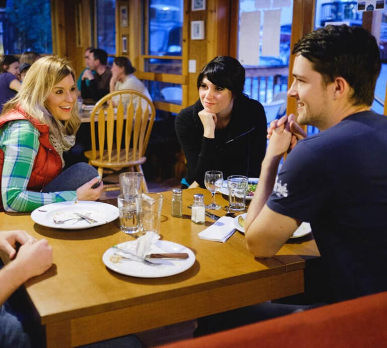 Friends eating at the June Bug Cafe