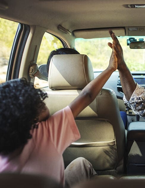 road trip high-fives in the car
