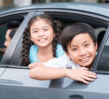 kids looking out car window