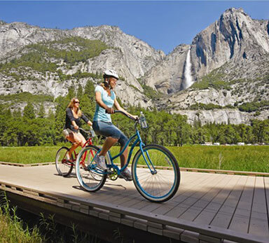 Two women riding bikes in Yosemite Valley