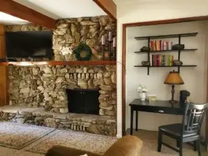 rock fireplace with television