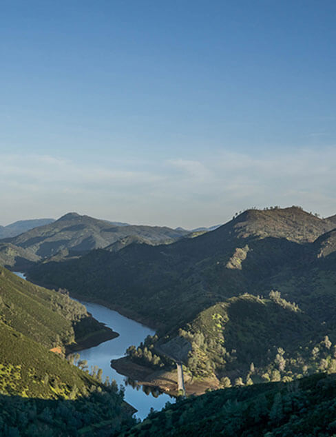 view of a valley with a river running through it