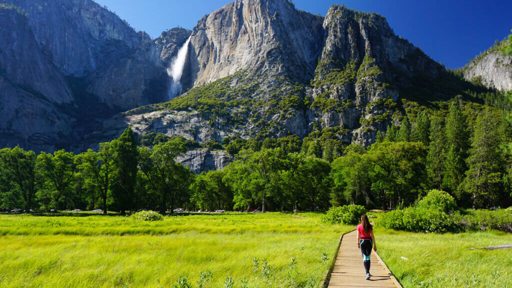 Woman walking toward Yosemite Falls