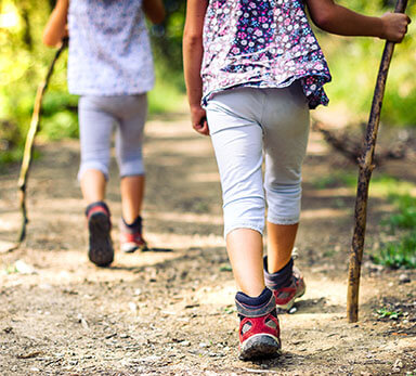 children hiking on a trail