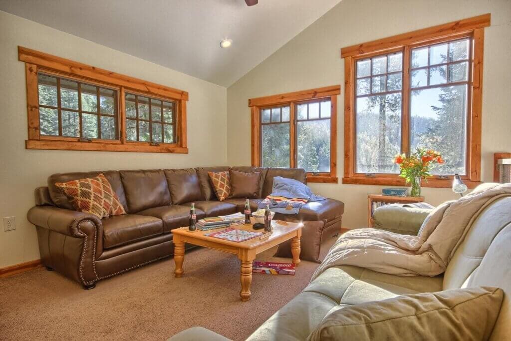 living room with couches and windows