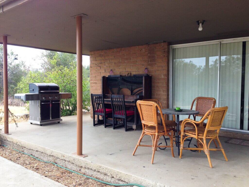 porch with grill and outdoor seating