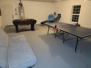 game room with foosball table, ping pong