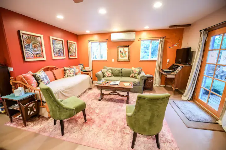 living room with couches and chairs