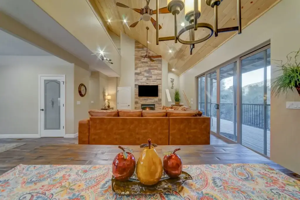 living room with couch and vaulted ceilings