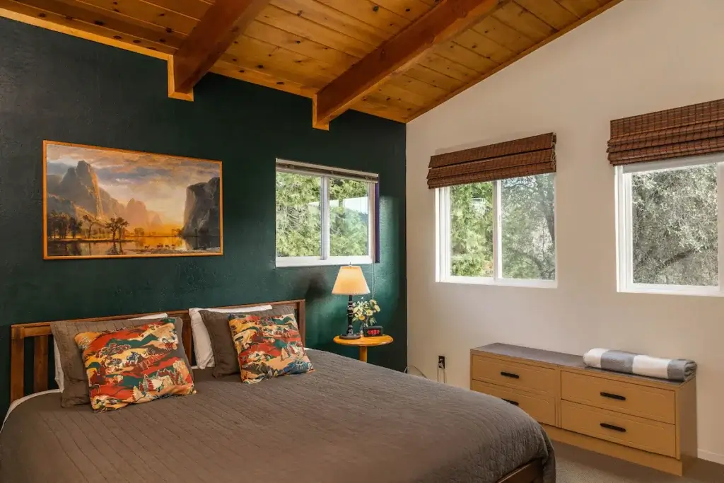 bedroom with king size bed and wooden ceiling