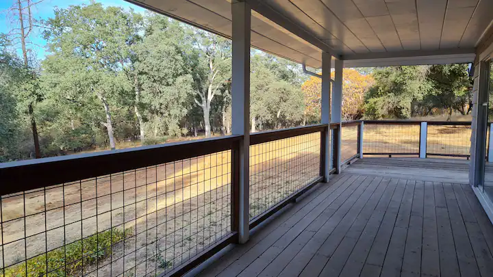 deck with hogwire fence looking out over property