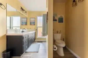 bathroom with vanity and toilet nook