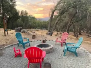 fire pit with colorful chairs