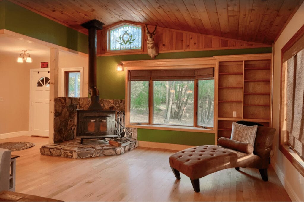 living area with wood stove and seat