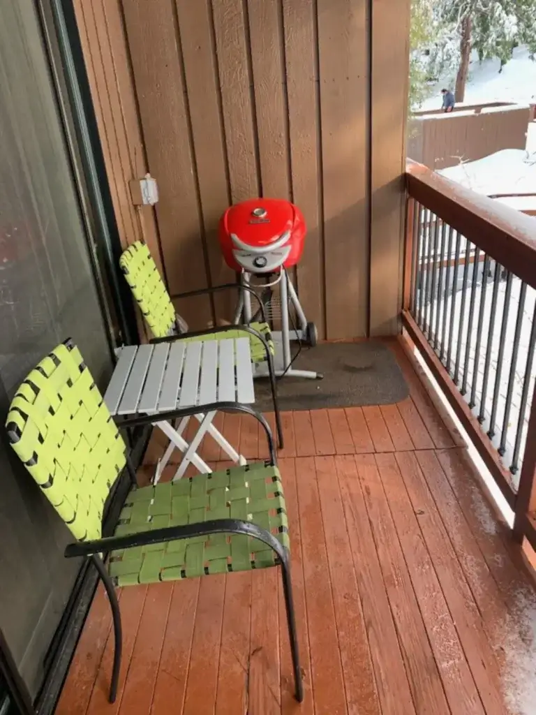 balcony with outdoor seating and grill
