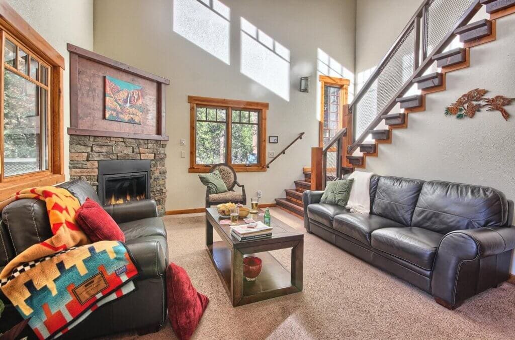 living room with fireplace and stairs