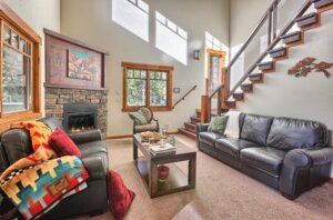 living room with fireplace and stairs