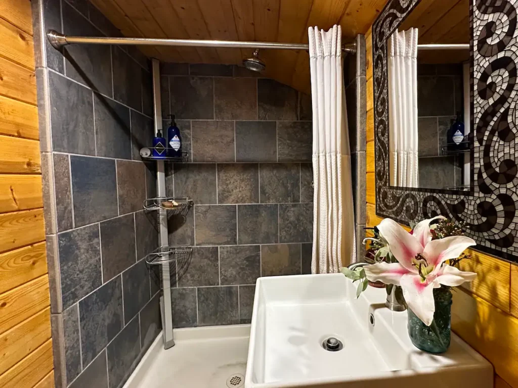 bathroom with slate tiled shower