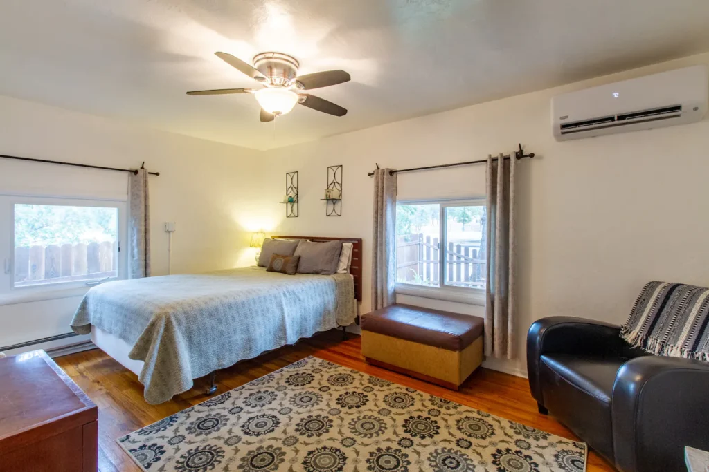 bedroom with queen bed and sitting area