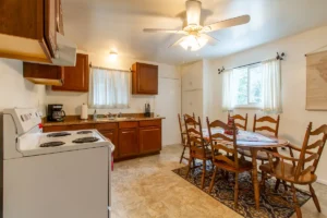 kitchen with freestanding appliances and dining area