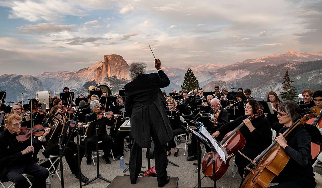 Mariposa Yosemite Symphony Orchestra at Glacier Point with Half Dome in the background