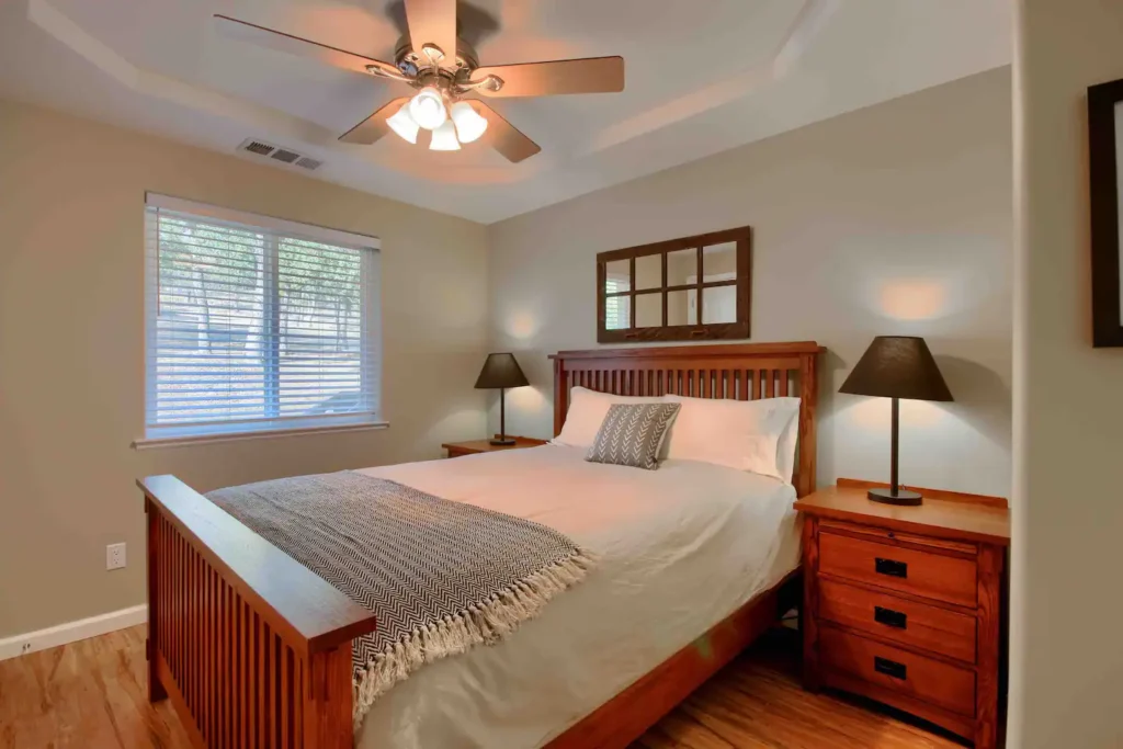 queen bed with wood bedframe