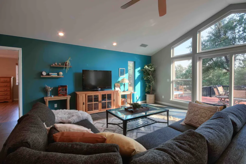 living room wall with television and couches