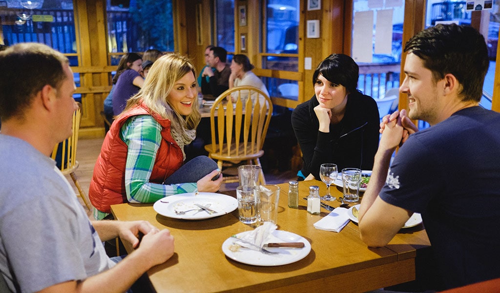 Friends enjoying a meal at the June Bug Cafe, one of the Yosemite food options in Mariposa County