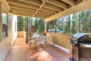 deck with outdoor seating and grill