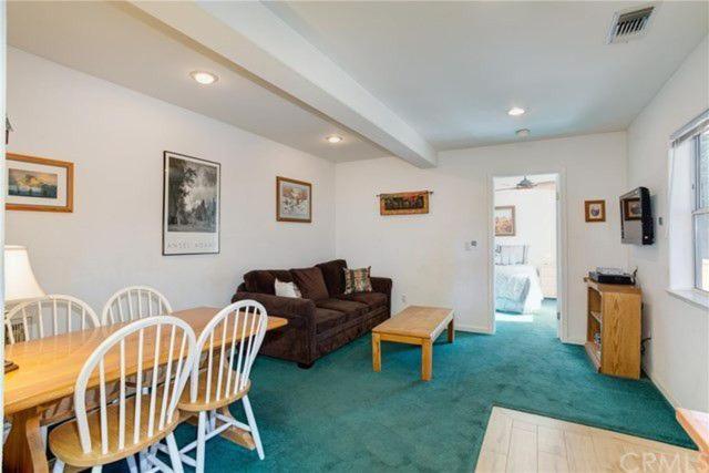 living room with green carpet