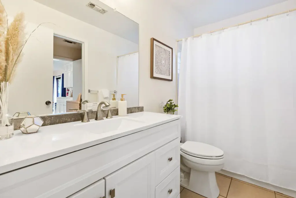 bathroom with vanity and shower tub