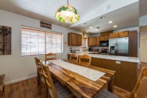 dining table and fully equipped kitchen