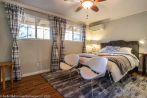 bedroom with king bed and seating area