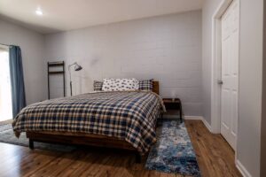 bedroom with bed and plaid bedspread