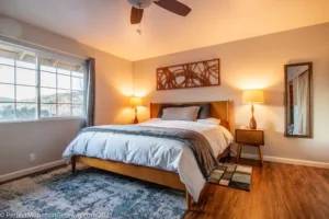 bedroom with bedside tabes and lights