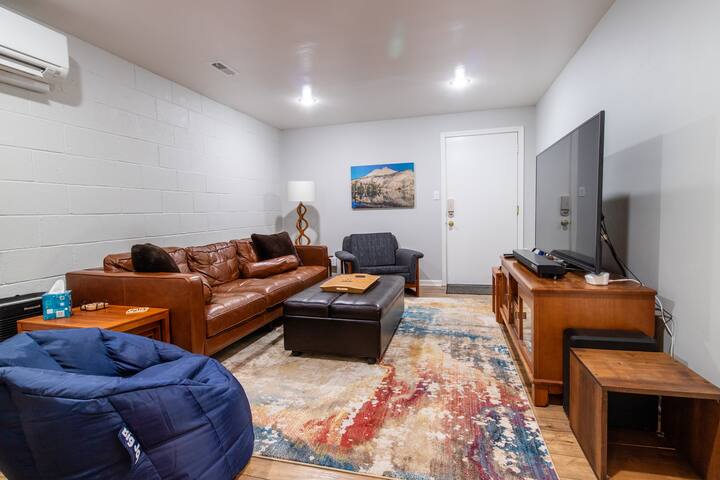 living area with couches and television