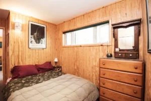 bedroom with queen bed and dresser