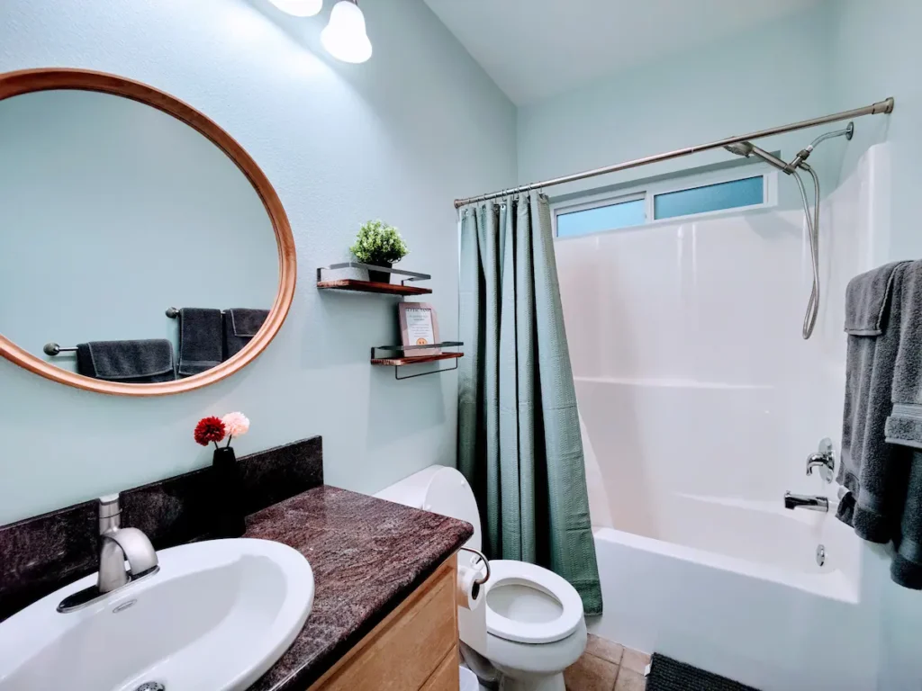 bathroom with shower and tub