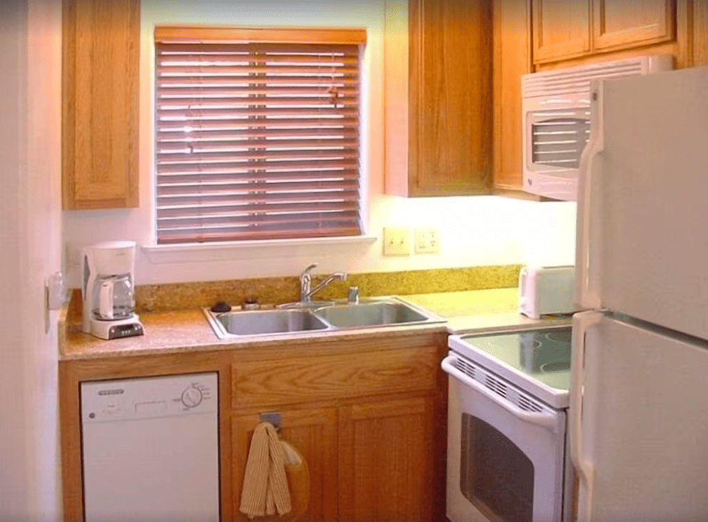 kitchen with wood cabinets and white appliances