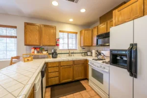 kitchen with wooden cabinets and white countertops