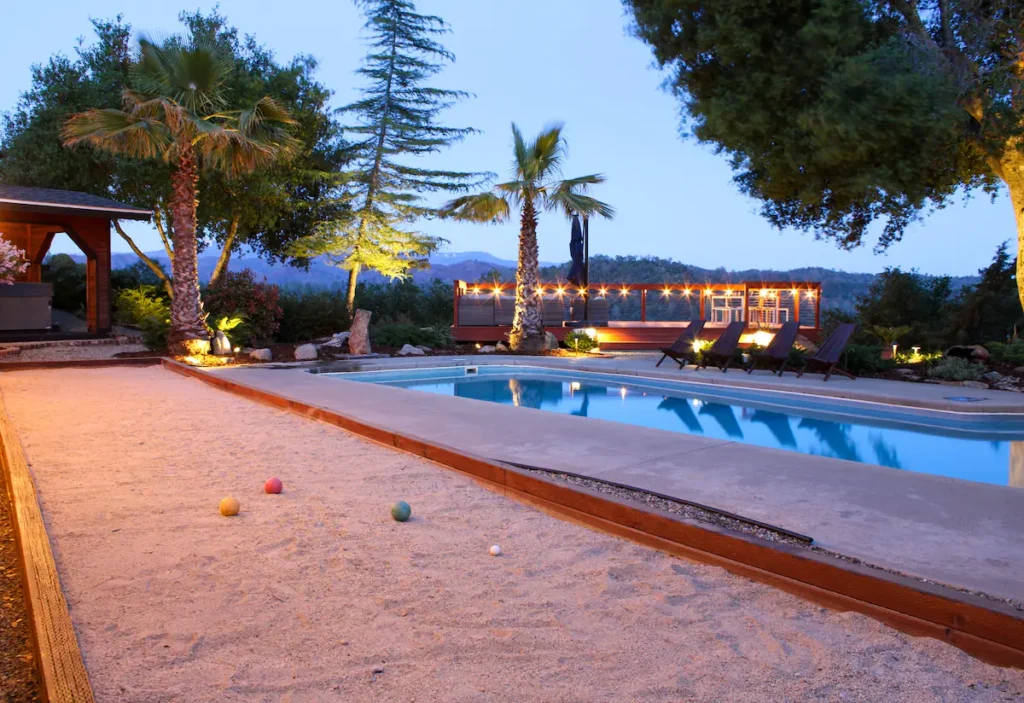 bocce ball court next to pool