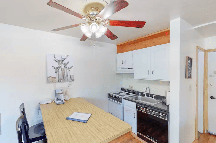 kitchenette with stove and refrigerator