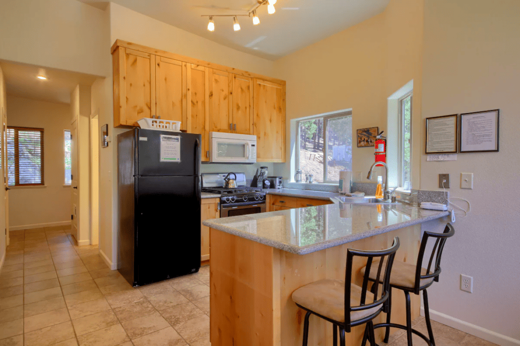 fully equipped kitchen with bar seating