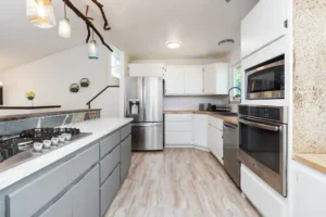 kitchen with large island, and white cabinets