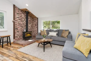 living room with wood stove and couches