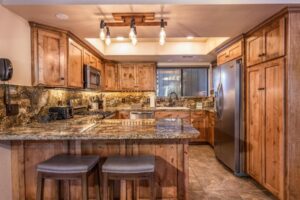 kitchen with wood cabinets, bar seating