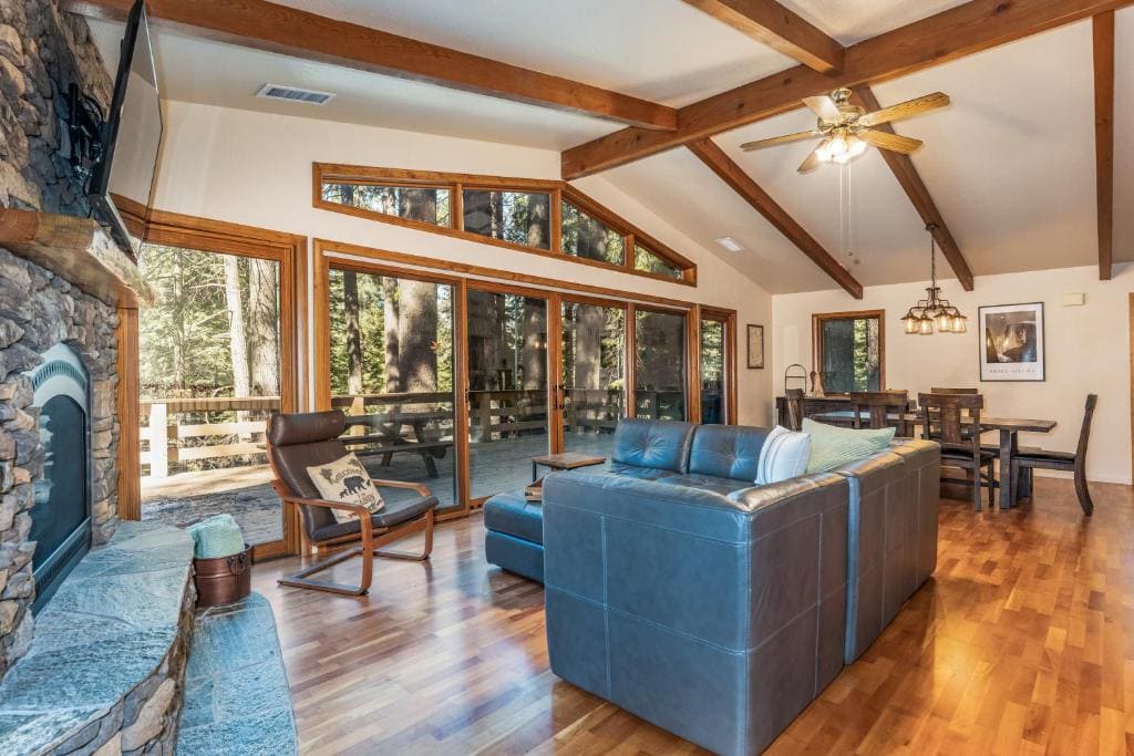 living room with beamed ceilings , couches, fireplace